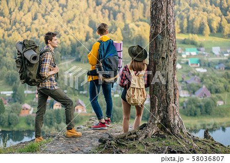 three tourists aking decission where to go three tourists aking decission where to go 58036807