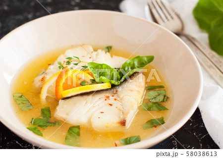 Fried cod with citrus butter sauce 58038613