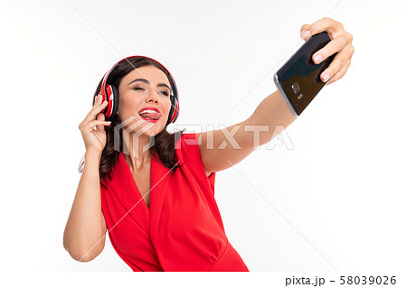 Girl with phone. Digital gadget. Listening music. Woman model. Girl with phone. Digital gadget. Listening music. Woman model. 58039026