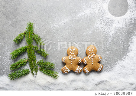 Flat lay of two gingerbread men having a walk on Flat lay of two gingerbread men having a walk on 58039987