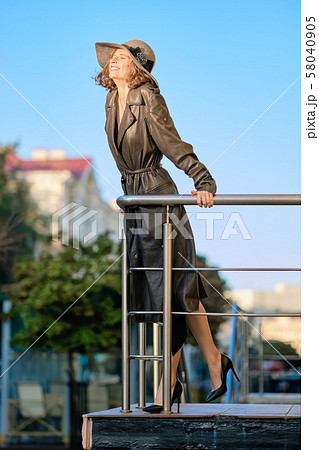 Beautiful lady in long vintage coat ant hat Beautiful lady in long vintage coat ant hat 58040905