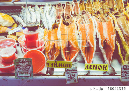 Dried fish Omul lying on the counter in Listvyanka, Lake Baikal. Siberia. Russia. 58041356