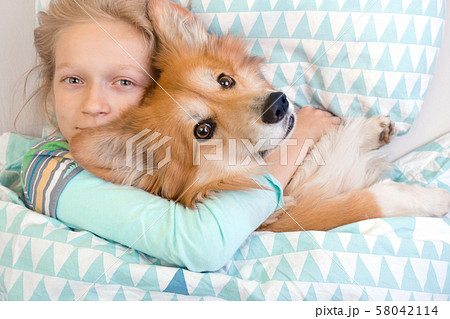 little girl sleeping in sleep mask 58042114