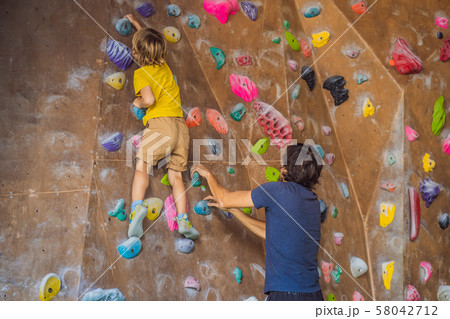 Dad and son at the climbing wall. Family sport, healthy lifestyle, happy family 58042712