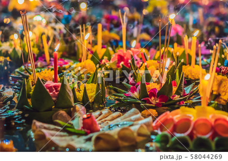 Loy Krathong festival, People buy flowers and candle to light and float on water to celebrate the 58044269