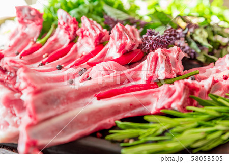Raw lamb ribs on kitchen table ready to be cooked Raw lamb ribs on kitchen table ready to be cooked 58053505