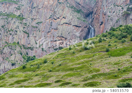 Summer landscape with mountain waterfall between two rocks 58053570