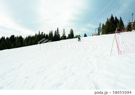 A young man is skiing in the Carpathians on the 58055094