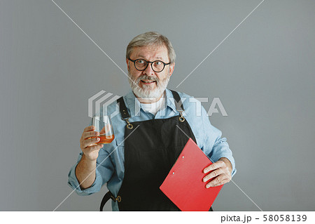 Confident senior man brewer with self crafted beer 58058139