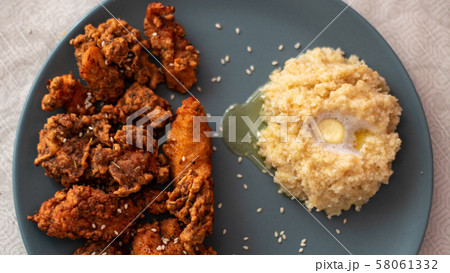 crispy chicken with garnish of porridge crispy chicken with garnish of porridge 58061332