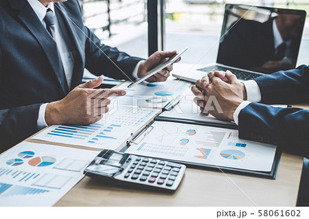 Two executive discussing company growth project 58061602