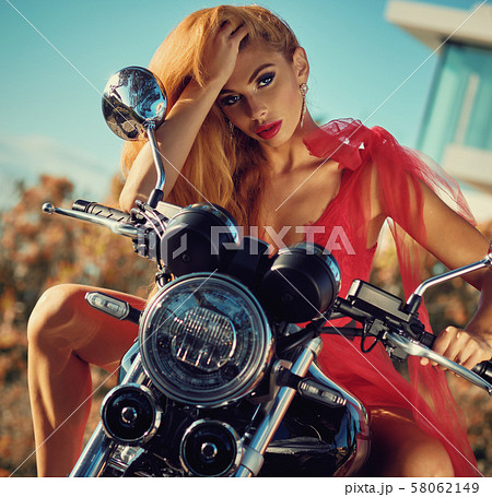 Sexy woman posing on motorcycle 58062149