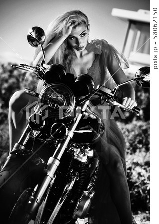 Sexy woman posing on motorcycle 58062150
