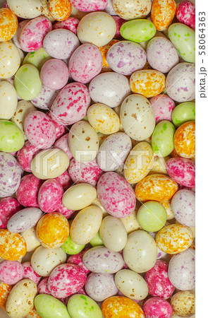 multicolored candies or chocolates in glaze multicolored candies or chocolates in glaze 58064363