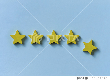 Line of five gold stars with one dropping away 58064842