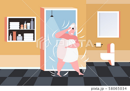 fat obese woman in white towels wrapped around head and body after shower unhealthy lifestyle 58065034
