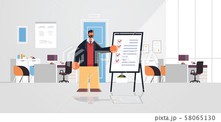 businessman working with check list business man standing near flip chart with questionnaire survey 58065130