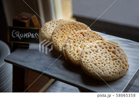 Hot toasted English crumpets 58065358