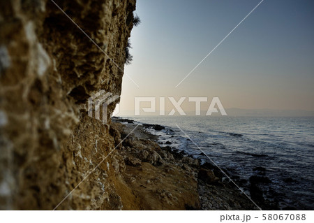 sandy beach and sea at sunset sandy beach and sea at sunset 58067088