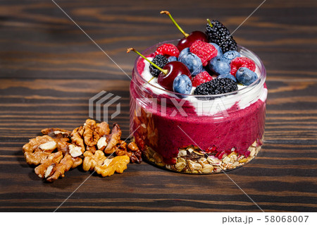 Breakfast with oatmeal, fruit and walnuts Breakfast with oatmeal, fruit and walnuts 58068007