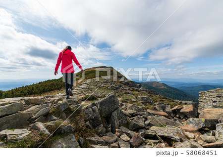 girl athlete on top of the mountain. 58068451