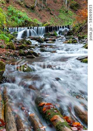 Mountain waterfall in autumn forest Mountain waterfall in autumn forest 58069935