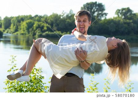 happy romantic couple in love and having fun outdoor in summer day, beauty of nature, harmony 58070180