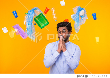 World Environment Day, plastic recycling problem and environmental disaster concept - Scared Indian World Environment Day, plastic recycling problem and environmental disaster concept - Scared Indian 58070333