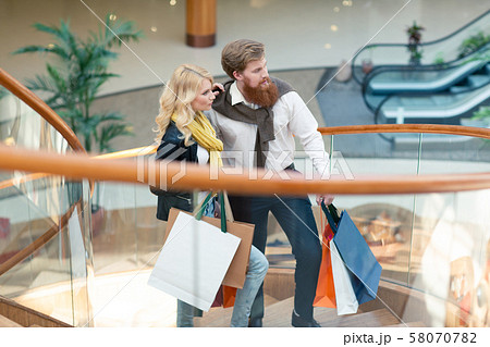 Couple with shopping bags 58070782