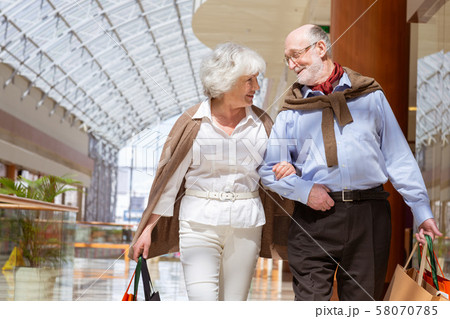 Senior couple with purchases Senior couple with purchases 58070785