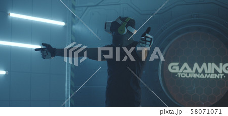 Gamer playing with VR action game 58071071