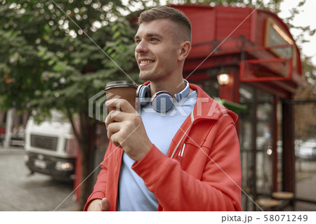 Pleased man with a cup of coffee 58071249