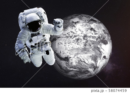 Astronaut close to the frozen Earth 58074459