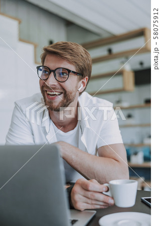 Man having a good mood during working day 58075912