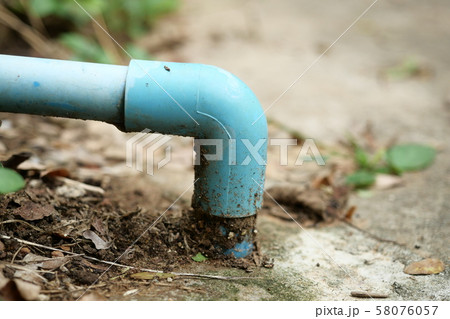 Plumbing pipe coupling on concrete floor, Blue PVC pipe for water transportation by pipeline	 58076057