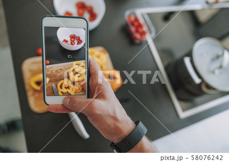 Cook making smartphone pictures of the vegetables Cook making smartphone pictures of the vegetables 58076242