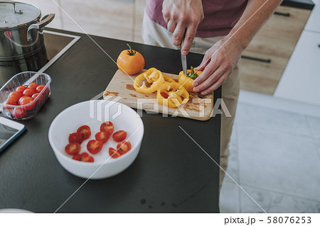 Cook chopping vegetables preparing salad for dinner Cook chopping vegetables preparing salad for dinner 58076253