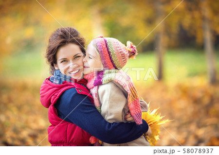 Mother and daughter in the autumn park 58078937