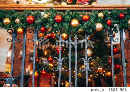 Christmas decoration lies on the forged railing. Christmas decoration lies on the forged railing. 58084901