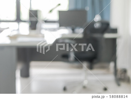 Blur background interior business office working space with pc personal computer screen in white room near glass window and wall Blur background interior business office working space with pc personal computer screen in white room near glass window and wall 58088814