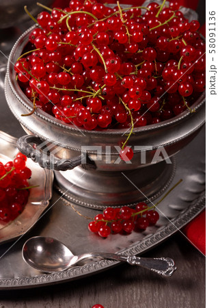 Fresh berries of red currant on a vintage 58091136