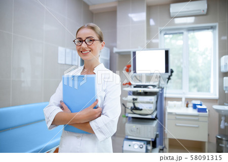 Happy woman enjoying work in hospital stock photo 58091315