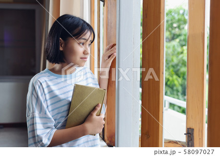 The girl hugged the holy scriptures The girl hugged the holy scriptures 58097027
