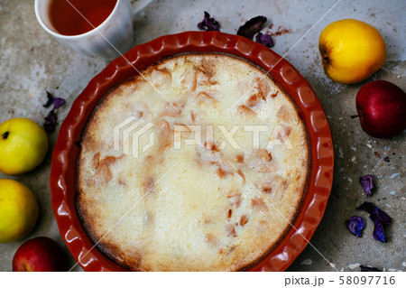 Apple pie and cup of tea on textured concrete background 58097716