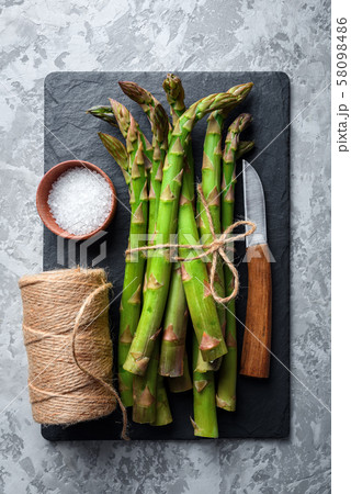 Green asparagus sprout on black board 58098486