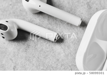 White wireless earphones or headphones with case. White wireless earphones or headphones with case. 58099301