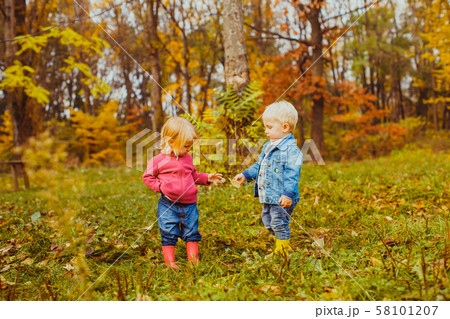 Cute kids walking in the autumn park 58101207