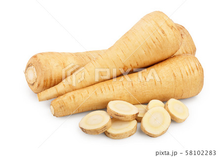 Parsnip root and slices isolated on white background closeup 58102283