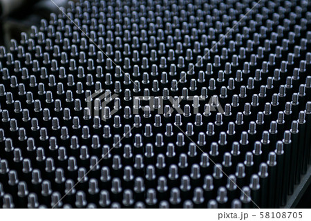 Close up shot of black screw thread bolts rowed up to a pattern background Art 58108705