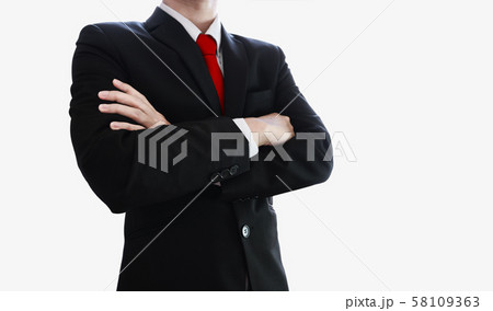 Businessman with red necktie and arm crossed, isolated 58109363